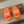 FURRY SLIDES IN ORANGE CURLY SHEARLING