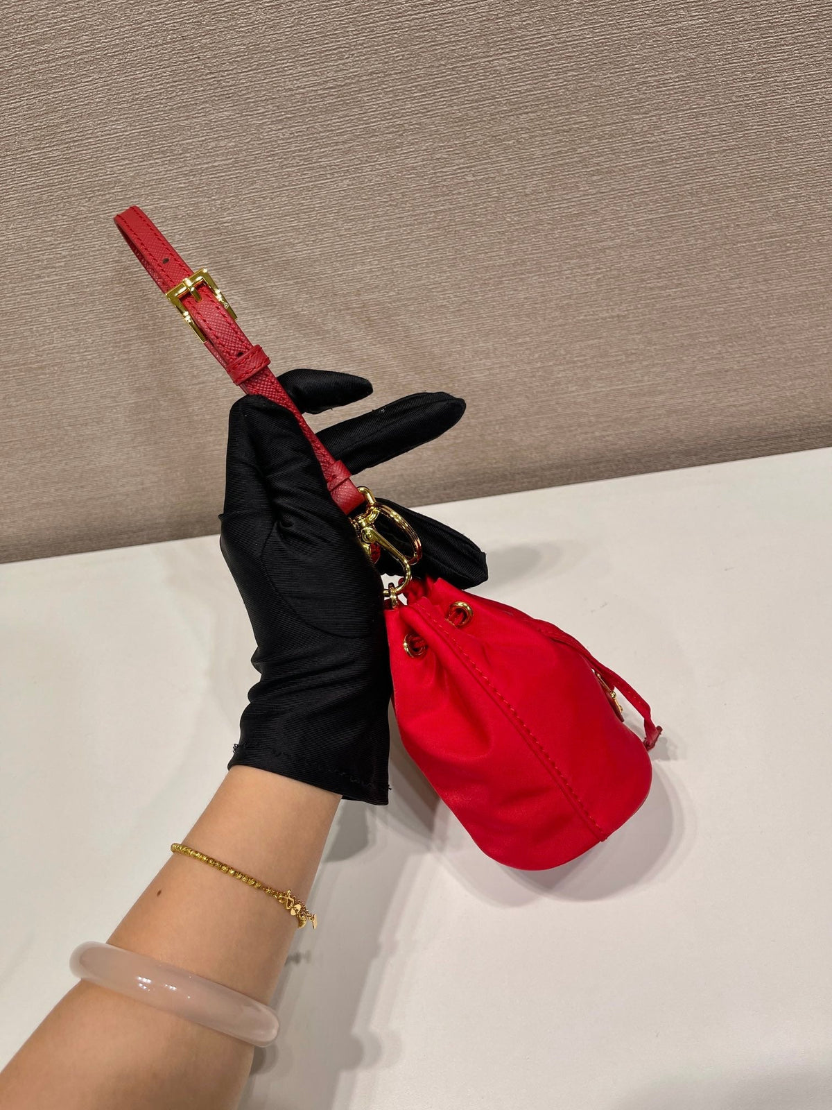 MINI BUCKET BAG 10 IN RED RE-NYLON AND SAFFIANO LEATHER STRAP