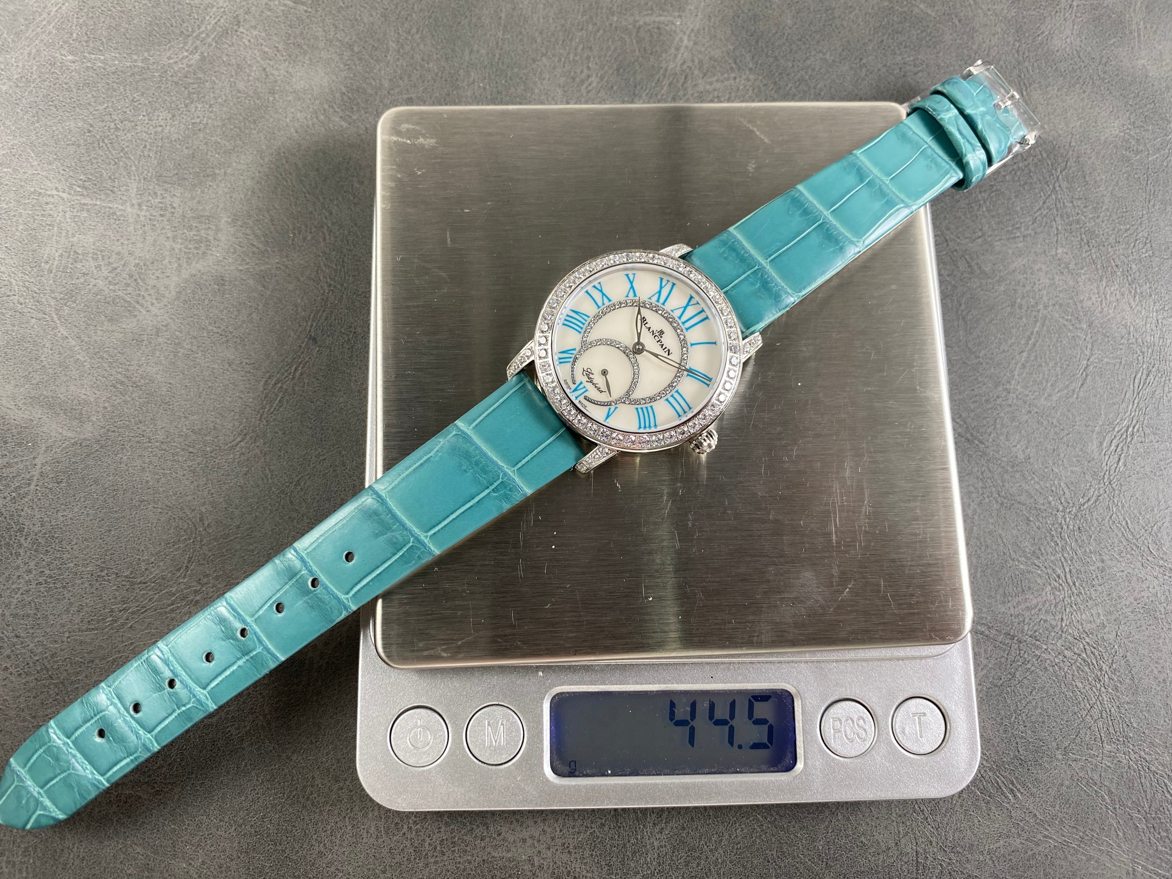 Blancpain's Ladybird 35mm White Blue Dial Diamond Bezel Leather
