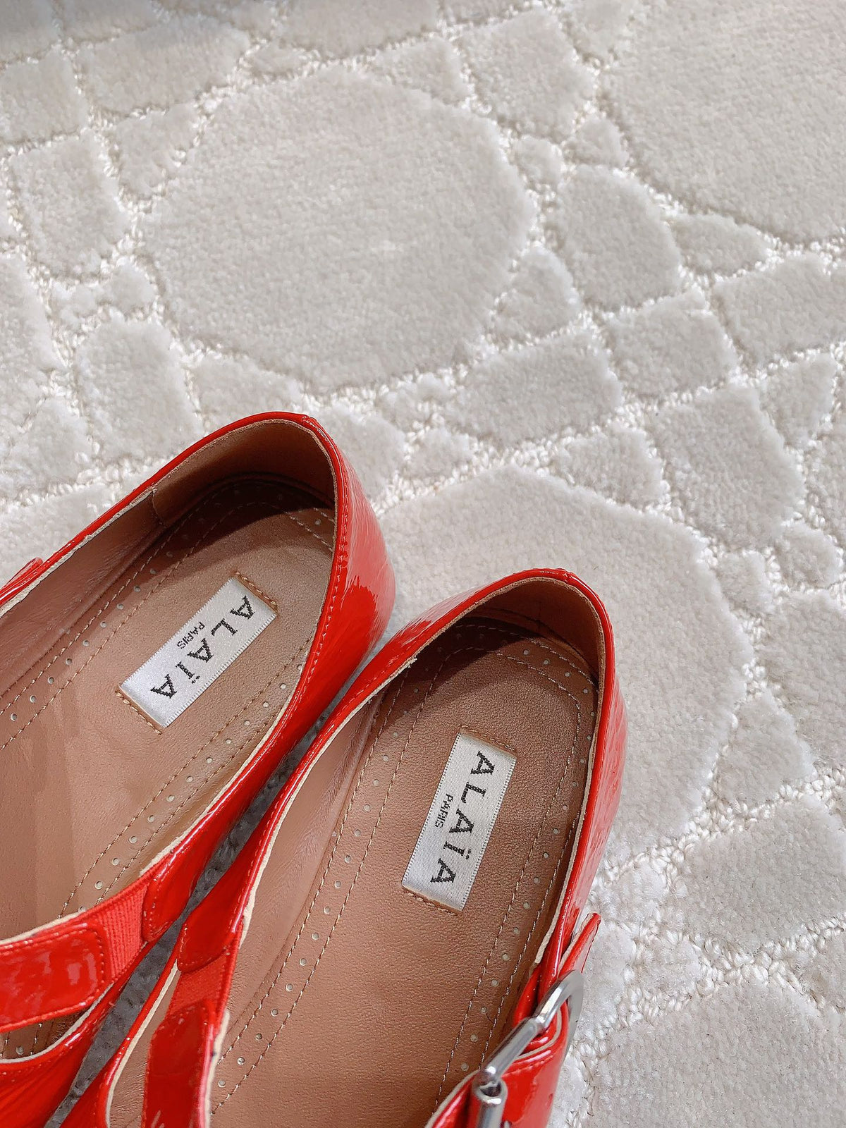 ALAIA CRISS CROSS BALLET FLAT IN CANDY RED LAMBSKIN WITH SILVER HARDWARE
