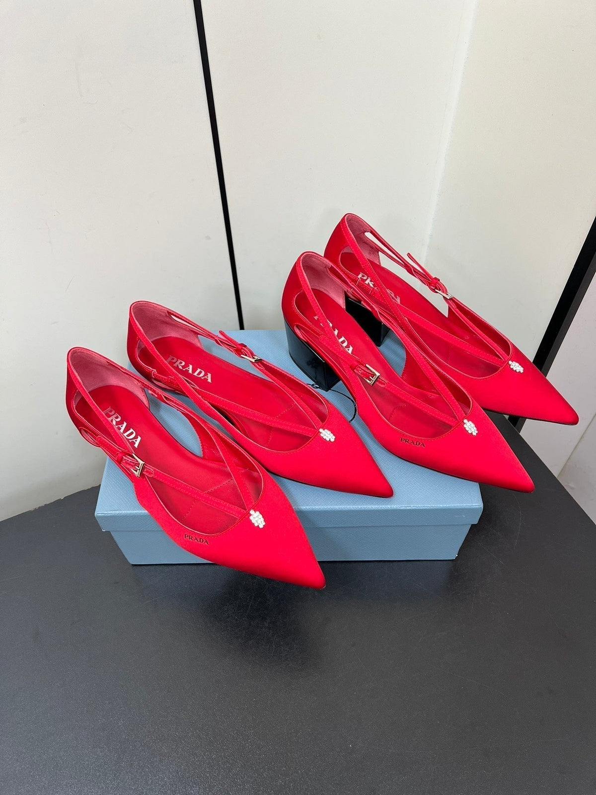 CUT-OUT PUMPS WITH BEAD BUCKLE IN CLASSIC RED SATIN