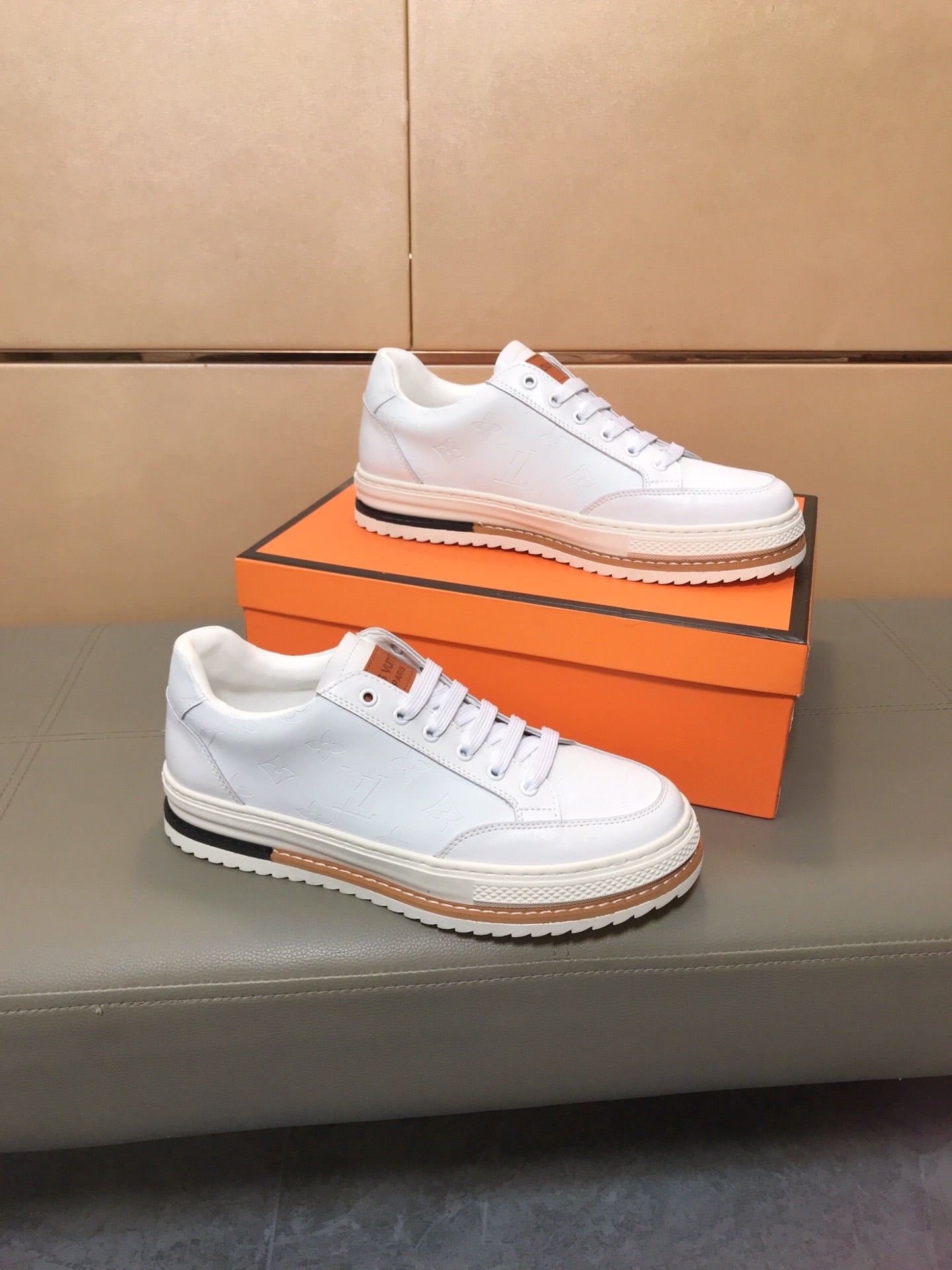 LV TRAINER IN EMBOSSED WHITE SUEDE