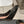 ALAIA ROUND-TOE HIGH HEELS 10 CM IN BLACK CALFSKIN