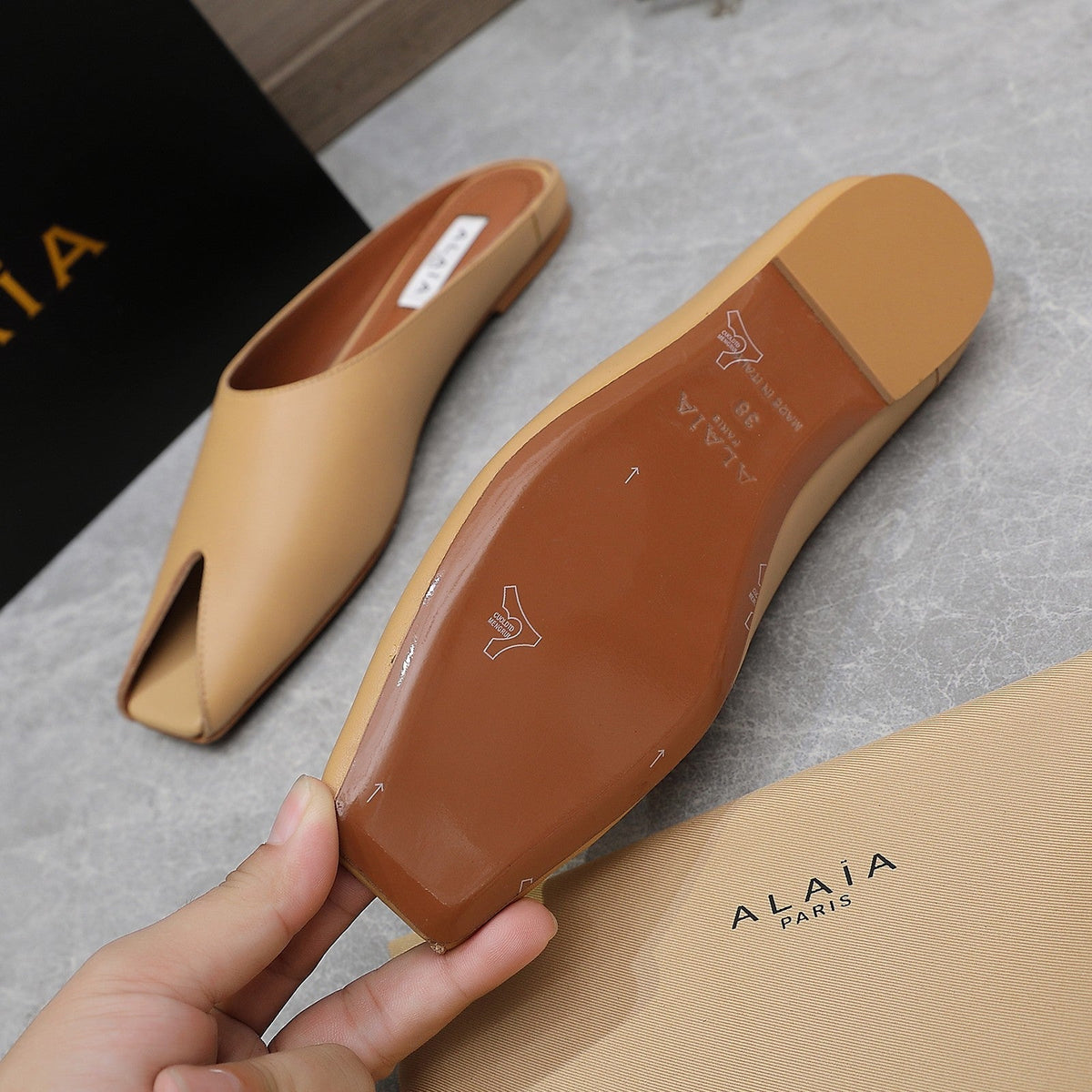 ALAIA FLAT MULE IN SEPIA TAN LAMBSKIN