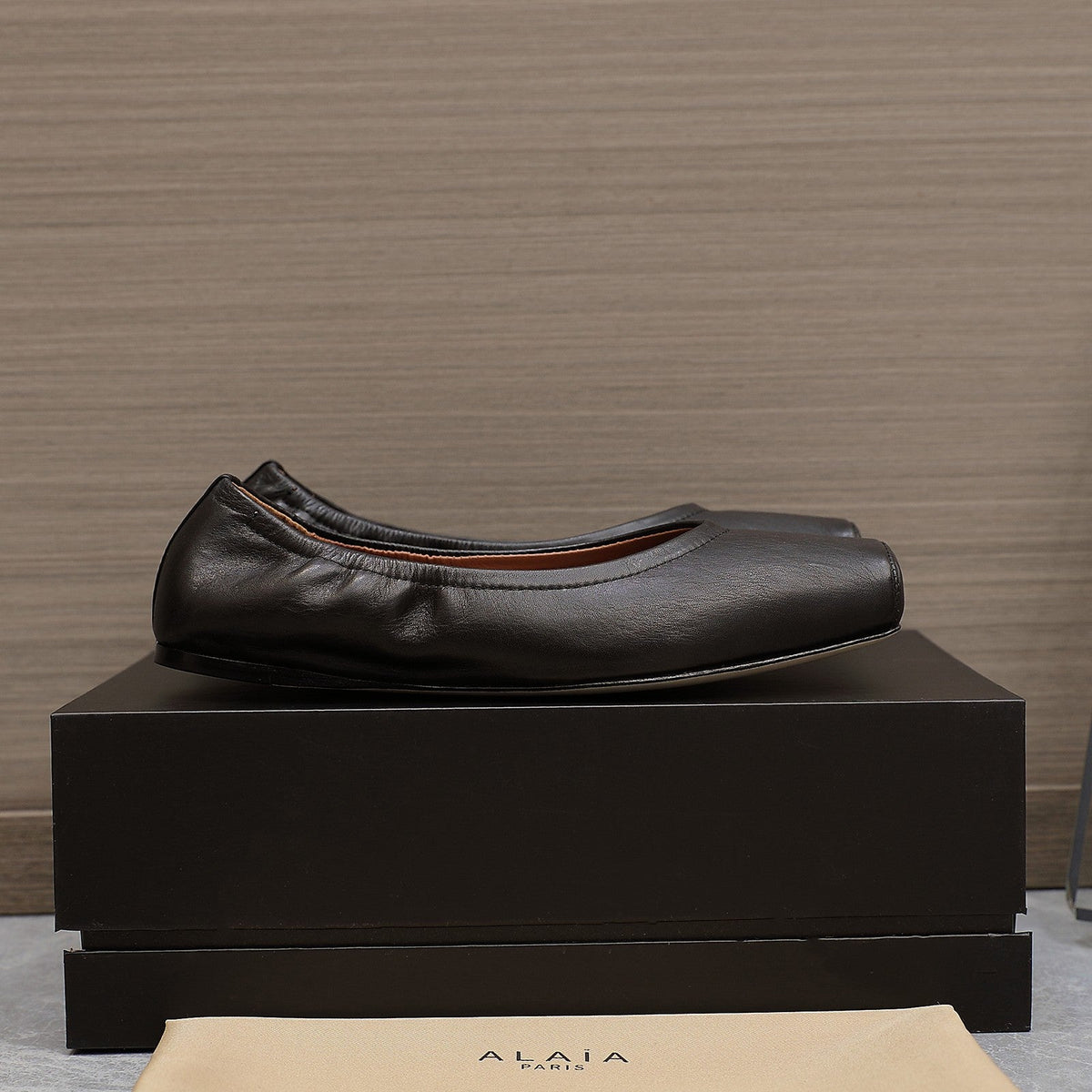 ALAIA BALLET FLATS IN BLACK SMOOTH CALFSKIN