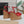 ALAIA WEDGE SANDAL IN CHERRY RED MESH AND BEIGE RUBBER